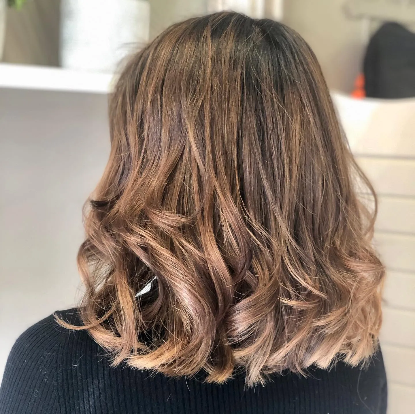 Soft blonde balayage and organic styling by Emilia Hair Studio